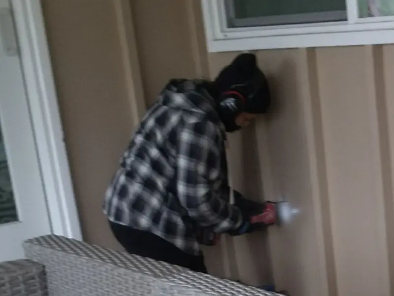 Professional electrician installing an exterior outlet in Dahlgren